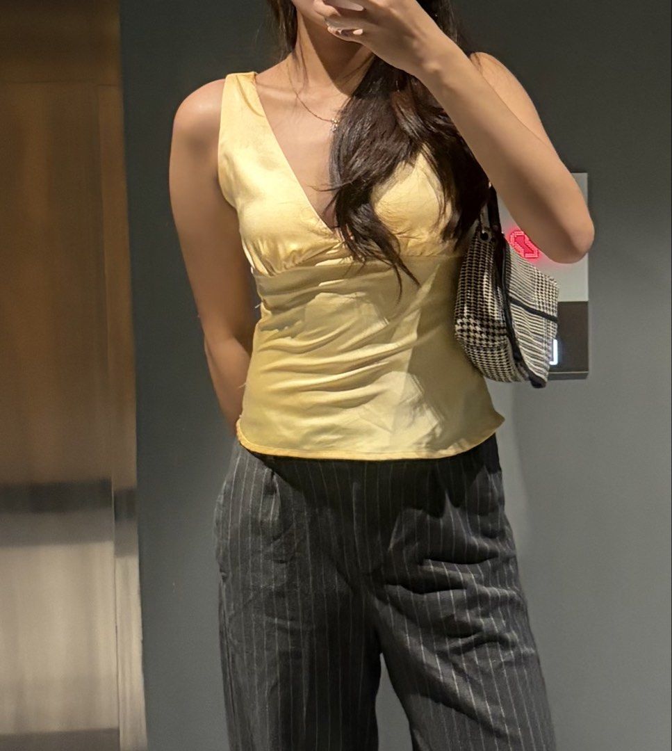 Yellow Satin V-Neck Sleeveless Top (Category: Sleeveless) located in Manila. Submitted by cpaa.aaa (Listing ID 1468138322, Image 2). Description: Satin Yellow Adjustable tie string detail at the back Size: XS-S.