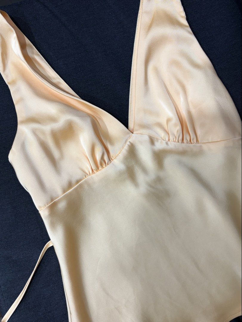 Yellow Satin V-Neck Sleeveless Top (Category: Sleeveless) located in Manila. Submitted by cpaa.aaa (Listing ID 1468138322, Image 3). Description: Satin Yellow Adjustable tie string detail at the back Size: XS-S.