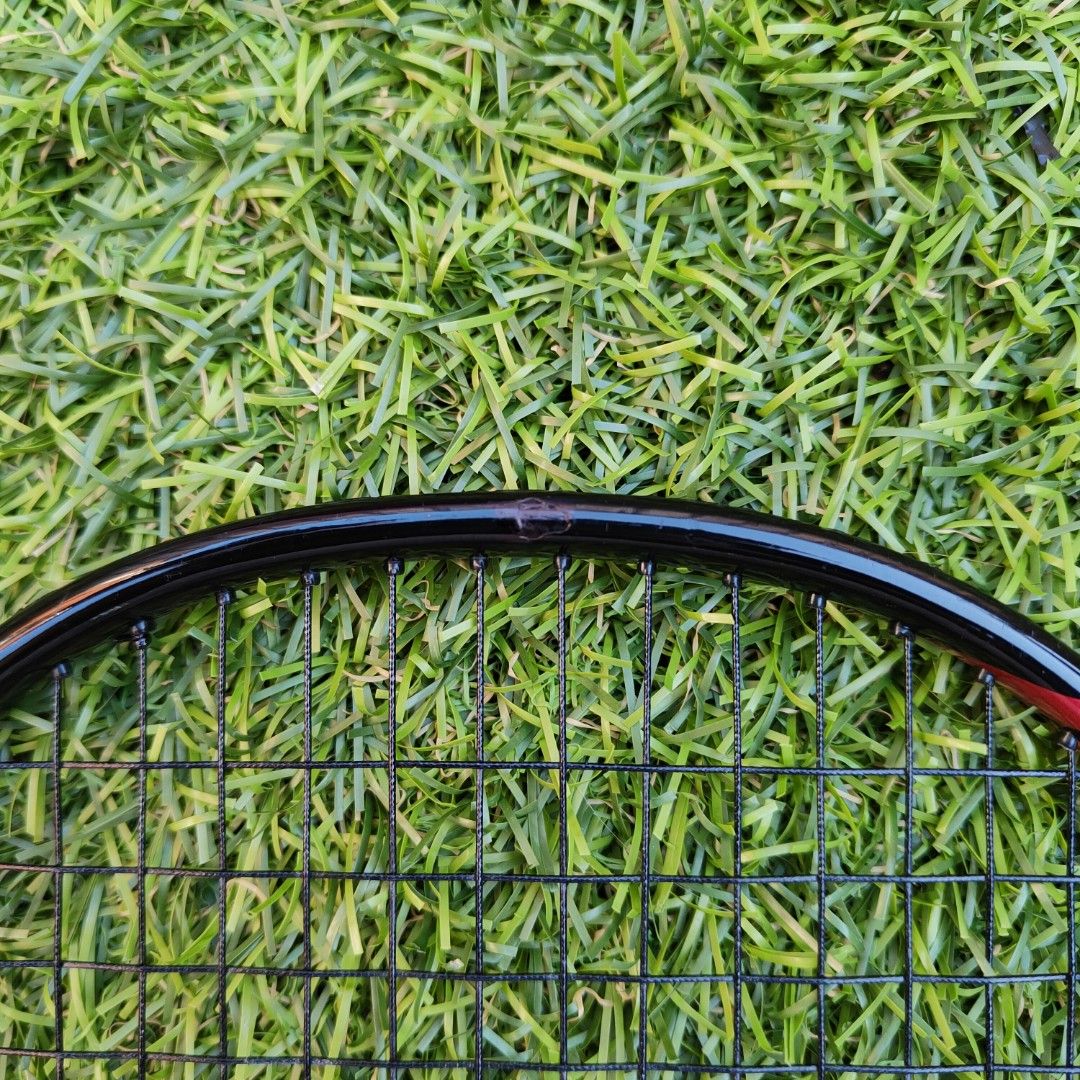 Astrox 22LT with Cover Case (Category: Racket and Ball Sports) located in Marikina City. Submitted by jonshop (Listing ID 1468140003, Image 3). Description: - Brand: Yonex - Colorway: Black frame with red and white accents - Handle: Wrapped in a bright yellow overgrip 420ex - Condition: String Yonex BG65 Black (29 tension) with one small scuff mark on the top of the frame - Inclusion: Comes with a black Yonex zip cover bag featuring white brandin