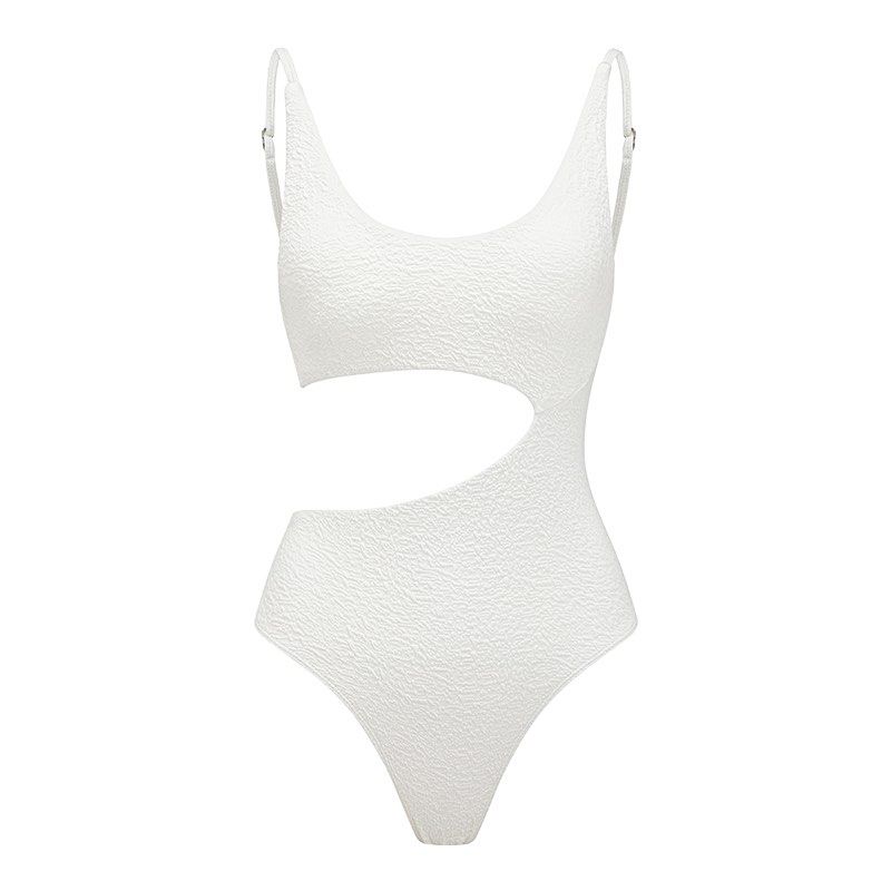 Yukari Swim - Ella White (Category: Bikinis & Swimsuits) located in Pasig City. Submitted by luckyvicky_ (Listing ID 1468085558, Image 2). Description: - Color: Clean solid white - Material: Trendy textured crinkle fabric - Design: Scoop neckline with adjustable metal strap hardware - Details: Chic asymmetric cut-out on the left side and waist - Cut: Flattering high-cut leg design.