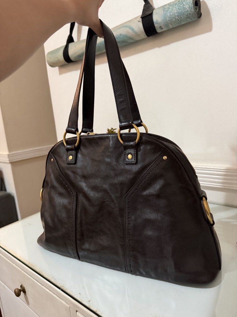 Yves Saint Laurent Muse Leather Handbag (Category: Luxury Bags & Wallets) located in Quezon City. Submitted by dclttrchs (Listing ID 1468227580, Image 2). Description: - Brand: Yves Saint Laurent (YSL) - Model: Muse Handbag - Material: Genuine soft leather with gold-tone hardware - Design: Classic structured dome shape with iconic Y-stitch detailing and top handles - Condition: Pre-loved, very well-maintained -RFS: I use my longchamp le pliage mo