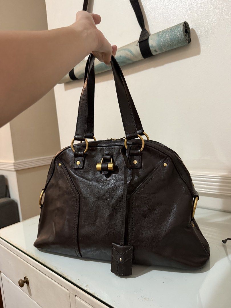 Yves Saint Laurent Muse Leather Handbag (Category: Luxury Bags & Wallets) located in Quezon City. Submitted by dclttrchs (Listing ID 1468227580, Image 1). Description: - Brand: Yves Saint Laurent (YSL) - Model: Muse Handbag - Material: Genuine soft leather with gold-tone hardware - Design: Classic structured dome shape with iconic Y-stitch detailing and top handles - Condition: Pre-loved, very well-maintained -RFS: I use my longchamp le pliage mo