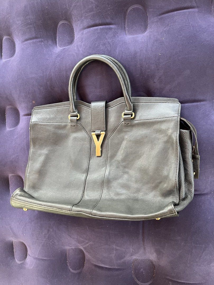 Yves Saint Laurent Y Cabas Tote Handbag Authentic (Category: Tote Bags) located in Tacloban City. Submitted by luxbag_phhh (Listing ID 1468084562, Image 3). Description: Authentic Yves Saint Laurent (YSL) - Material: Premium black leather - Hardware: Gold-tone accents with signature Y front strap closure and protective metal feet - Handles: Double top handles for comfortable carrying - Compartments: Secure zipped side compartments and a clean int