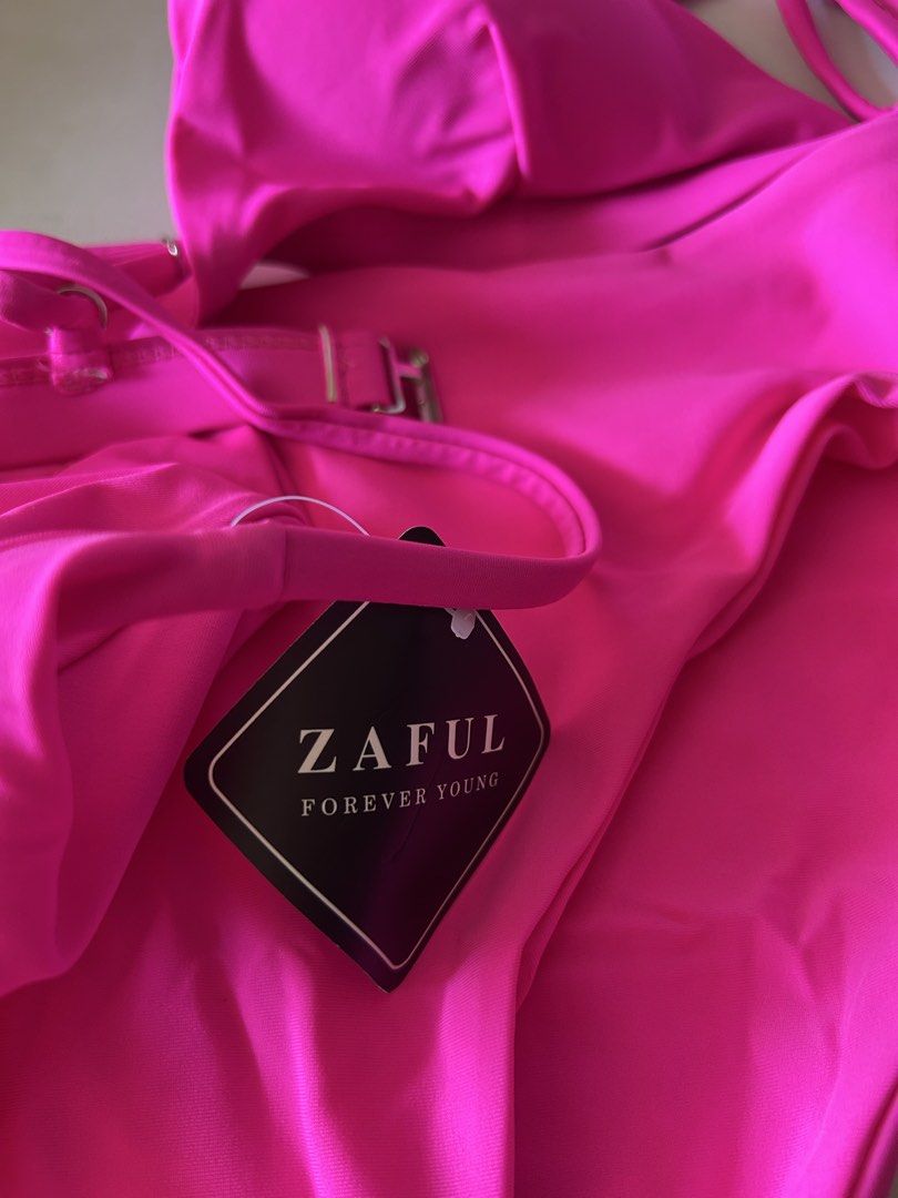 Zaful Neon Pink High Waisted Bikini (Category: Bikinis & Swimsuits) located in Bulacan. Submitted by peach1025 (Listing ID 1468068526, Image 3). Description: - Brand: Zaful - Style: Two-piece bikini set with high-waisted bottoms and triangle top - Color: Bright pink - Size: Medium (tag attached) - Condition: Brand new with original hangtag, never worn - Details: Adjustable gold-tone metal hardware on the back straps.