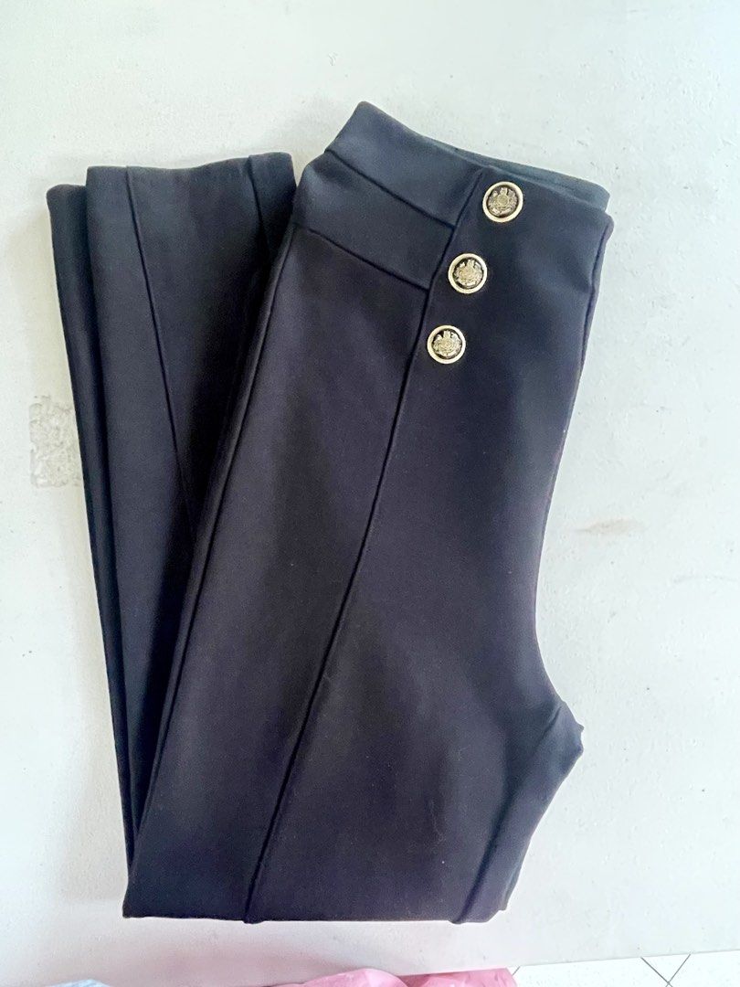 Zara Black Pants with Gold Buttons Size S (Category: Jeans) located in Manila. Submitted by tineferna08917 (Listing ID 1468099196, Image 2). Description: - Brand: Zara - Size: S (EUR S, MEX 26) - Color: Classic Black - Fit: High-waist with a comfortable elastic waistband in the back - Design: Statement gold crest buttons on each side and chic front seam details - Material: Stretchy, structured fabric - Origin: Made in Cambodia.