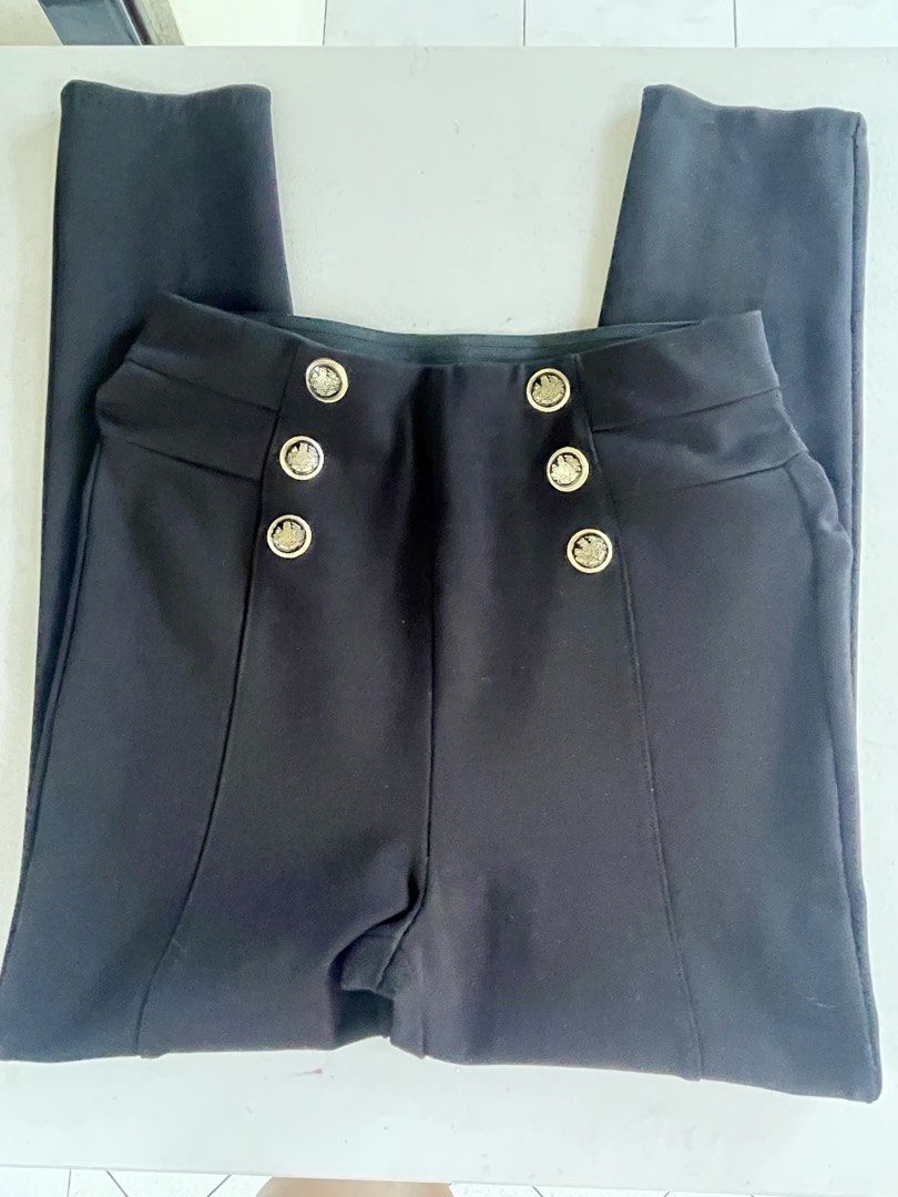 Zara Black Pants with Gold Buttons Size S (Category: Jeans) located in Manila. Submitted by tineferna08917 (Listing ID 1468099196, Image 1). Description: - Brand: Zara - Size: S (EUR S, MEX 26) - Color: Classic Black - Fit: High-waist with a comfortable elastic waistband in the back - Design: Statement gold crest buttons on each side and chic front seam details - Material: Stretchy, structured fabric - Origin: Made in Cambodia.