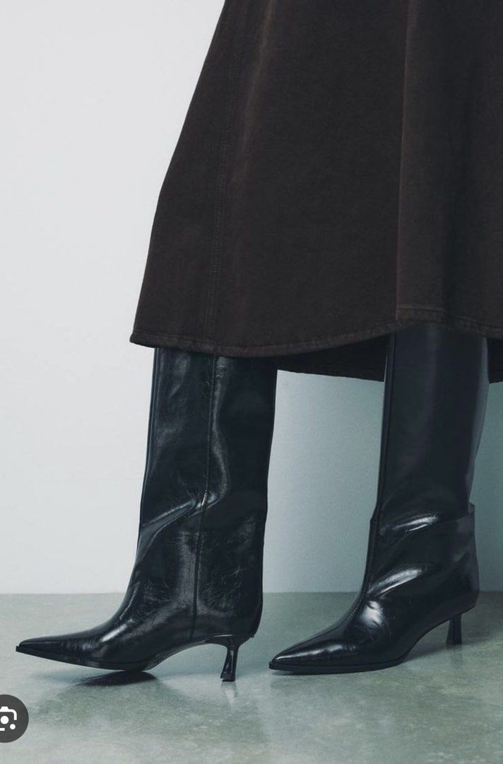 Zara Black Pointed Toe Kitten Heel Boots (Category: Boots) located in Makati City. Submitted by bibas.corner (Listing ID 1468167250, Image 2). Description: - Color: Black - Style: High-rise boots with slouchy shaft and curved front seam - Toe: Pointed toe - Heel: Slim stiletto kitten heel - Finish: Shiny/glossy material - Perfect for: Styling with skirts and dresses.