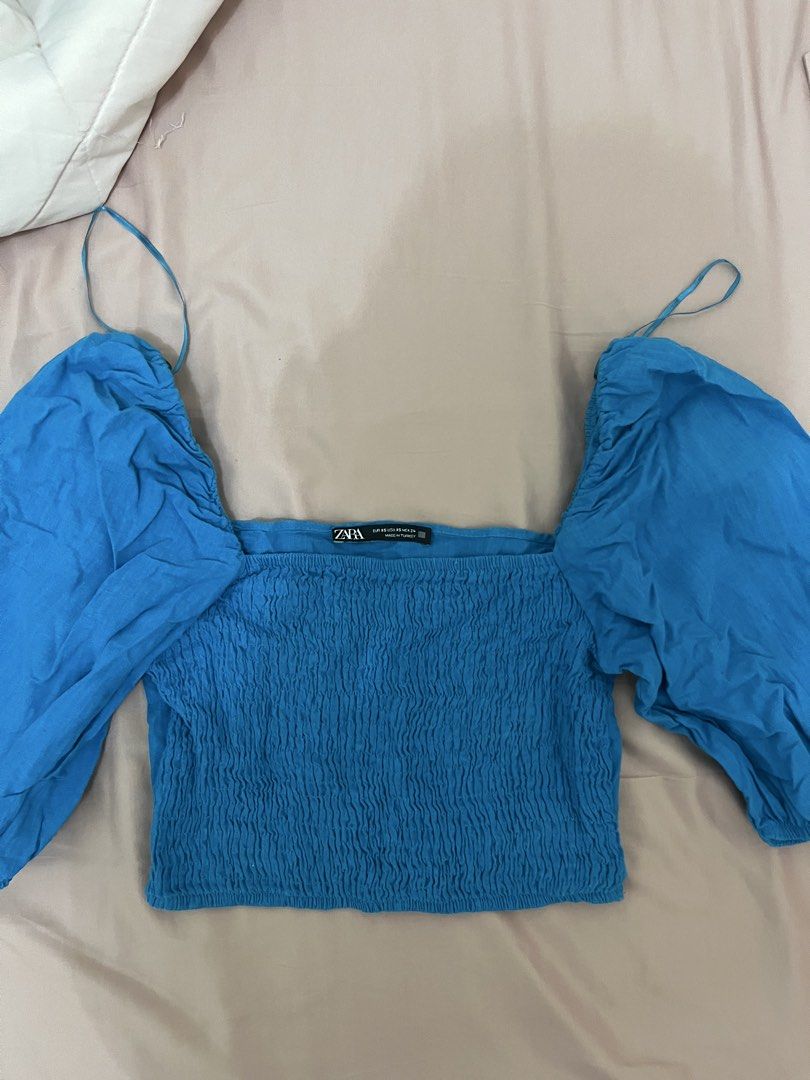 Zara blue smocked puff sleeve top (Category: Blouses) located in Tuguegarao City. Submitted by declutterf (Listing ID 1468182597, Image 1). Description: Super duper flattering, unfortunately doesnt fit me anymore :< Size XS-S.