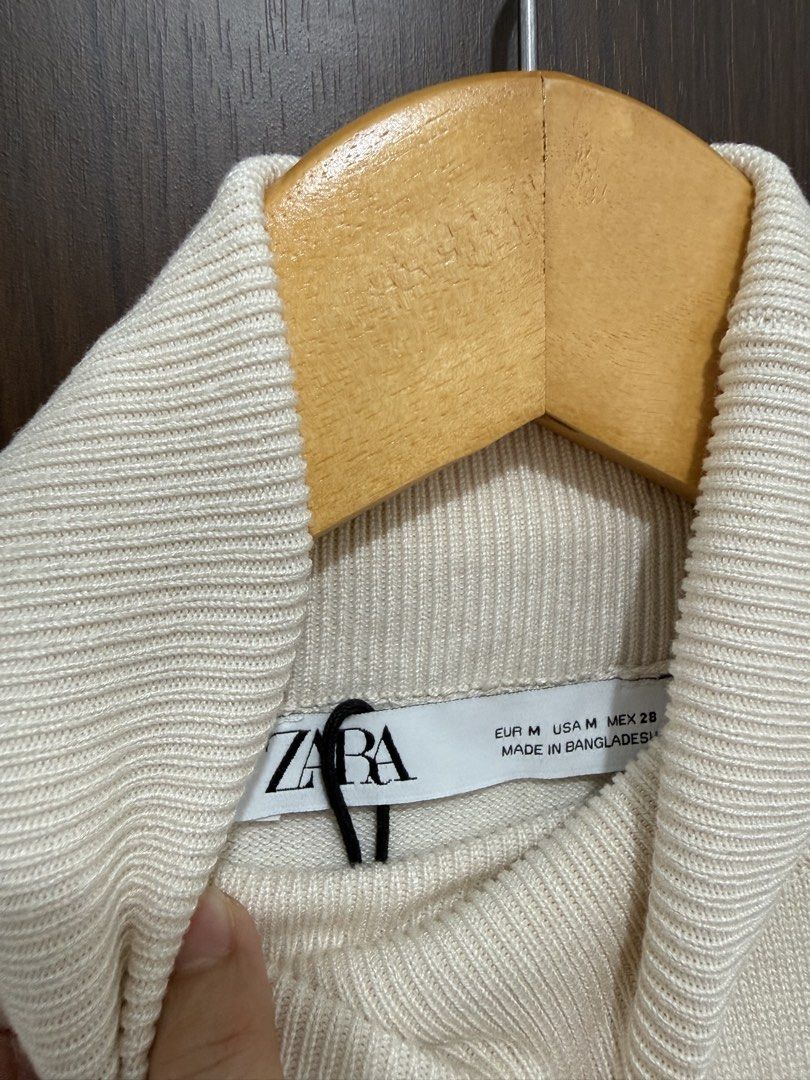 Zara cream turtleneck sweater with sheer patterned sleeves (Category: Longsleeves) located in Manila. Submitted by trinketsofhappiness (Listing ID 1468080499, Image 3). Description: - Brand/Model: Zara Turtleneck Sweater - Color: Cream - Size: Medium (EUR M, USA M) - Material/Design: Soft knit body with sheer textured dotted mesh sleeves, ribbed high neck, cuffs, and hem - Origin: Made in Bangladesh - Style Tip: Versatile neutral piece, great for
