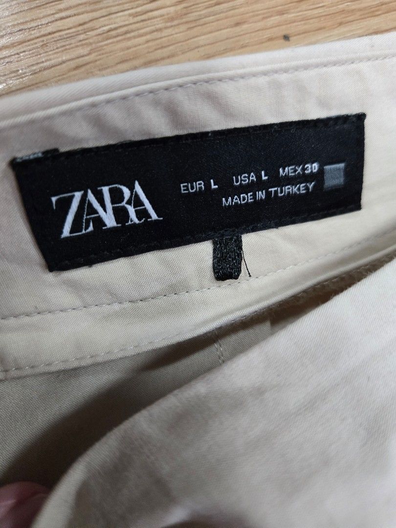 Zara khaki midi skirt (Category: Skirts) located in Quezon City. Submitted by jen_4kids (Listing ID 1468156442, Image 2). Description: zara khaki overlap midi skirt size L no pockets zipper on the side.