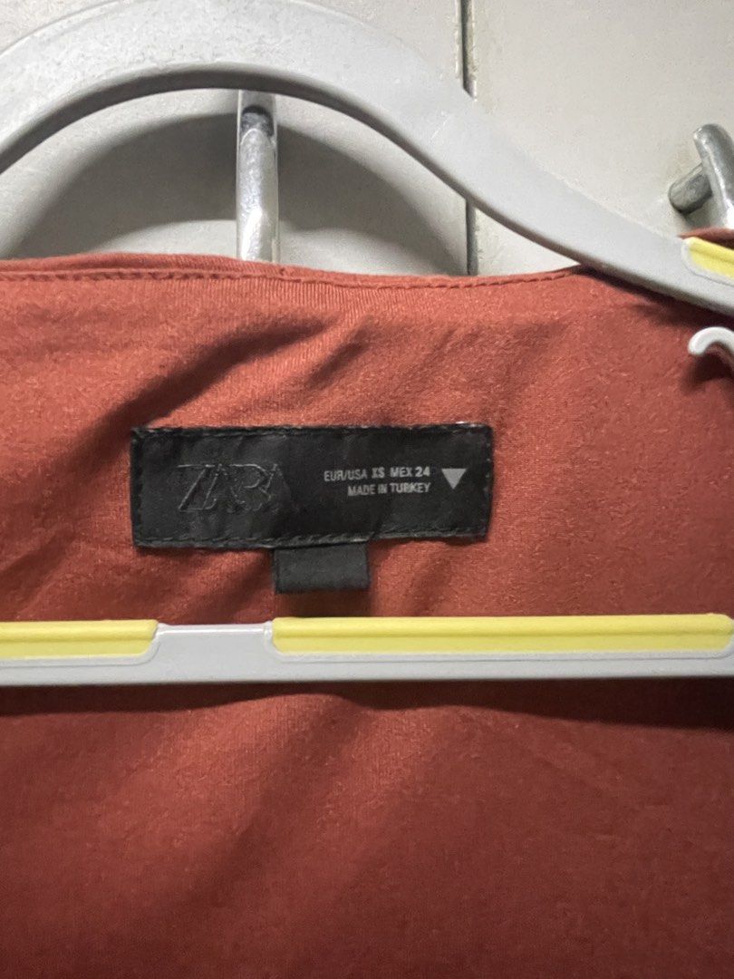 Zara Terracotta Vest (Category: Sleeveless) located in Quezon City. Submitted by prebyv (Listing ID 1468232133, Image 3). Description: Used twice only - Size: EUR/USA XS (MEX 24) - Color: Rich rust orange - Design: Scoop neckline, tailored silhouette, and back panel detailing - Closure & Pockets: Front four-button closure with two functional flap pockets - Origin: Made in Turkey.