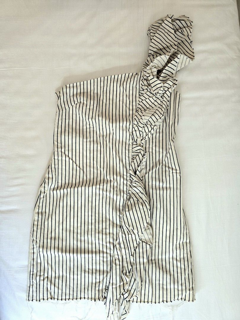 Zara Striped One-Shoulder Ruffle Dress (Category: Dresses) located in Las Pinas. Submitted by sandrapee (Listing ID 1468097128, Image 1). Description: Zara Asymmetric Denim Dress with Ruffles Trafaluc Denim One-shoulder Dress with Ruffles Size: Small Color: Striped Ivory Blue Material: 100% Cotton Like New Never used With very few and small yellow stains RFS: Size and decluttering.