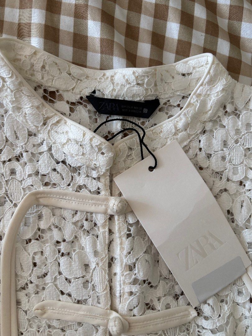 Zara White Full Lace Mandarin Collar Top (Category: Blouses) located in Marikina City. Submitted by koletteyy (Listing ID 1468092032, Image 2). Description: - Brand: Zara - Style: Sleeveless top with mandarin collar and Chinese knot frog buttons - Material/Design: Beautiful floral lace pattern throughout - Size: Medium - Condition: Brand new with original store tag attached, just tried on bust is 35-36 waist 28 NO LOWBALLER! NEW SA STORE TOH!.