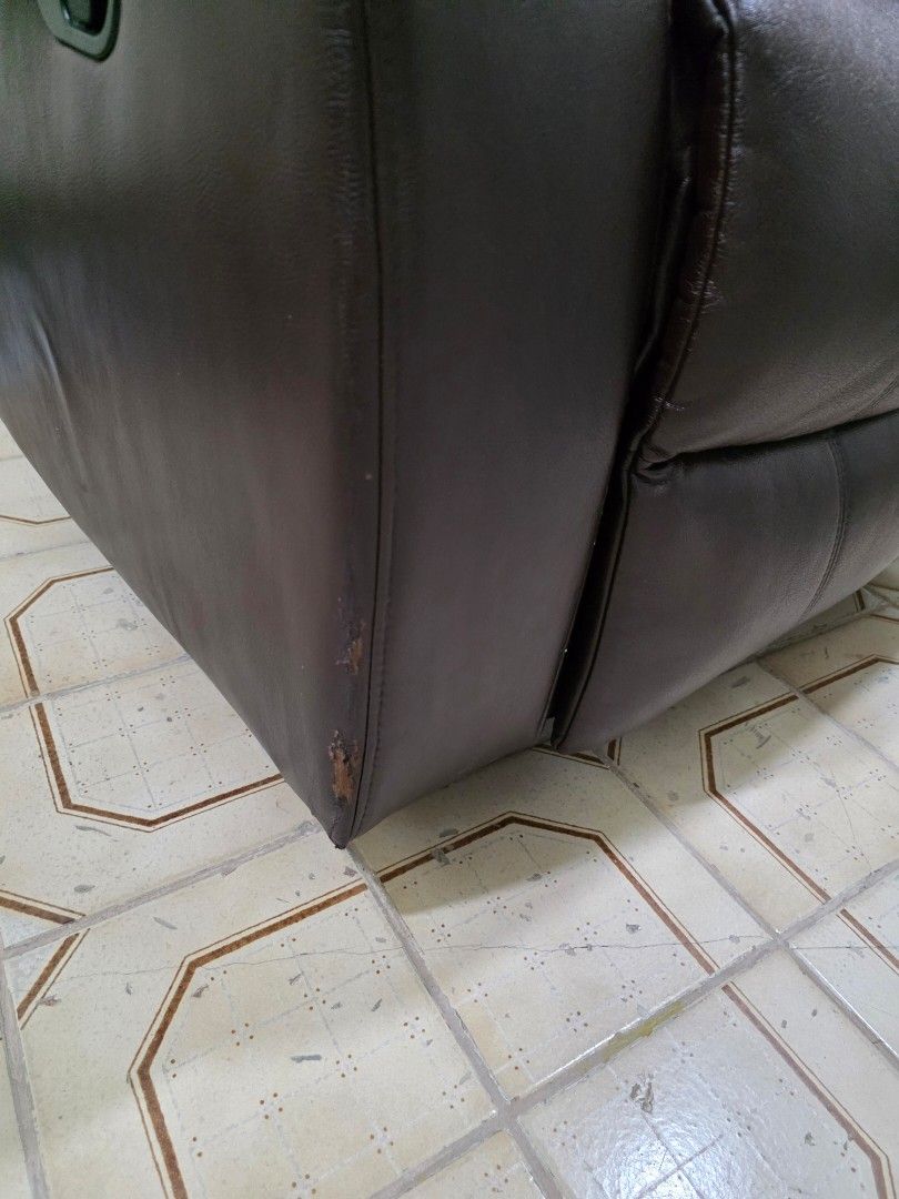 Zion Reclining Chair (Category: Chairs) located in Quezon City. Submitted by allaboutyoused (Listing ID 1468180363, Image 3). Description: Zion Reclining Chair: Dark brown leather - Ideal for: Living room or study - Comfort: Extra-thick cushioning on the backrest and armrests - Function: Sturdy build with a smooth manual recline mechanism - Condition: Shows some wear and scuffing on the top corner edges of the backrest as shown in photos - No iss