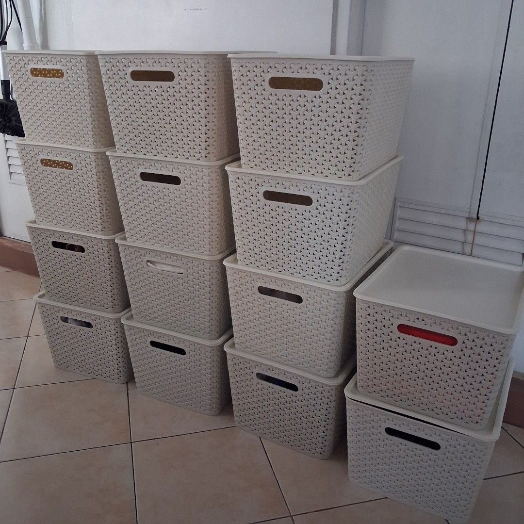 14 Pcs. Wicker Style Plastic Storage Baskets With Lids (Category: Storage Boxes & Baskets) located in Manila. Submitted by decluterring_manila (Listing ID 1468310768, Image 1). Description: Beige plastic storage boxes with woven pattern design. Built-in handles on the sides for easy carrying. Removable lids included. Stackable units help keep closets and shelves tidy. Durable material works great for organizing clothes, toys, or daily clutter. Qu