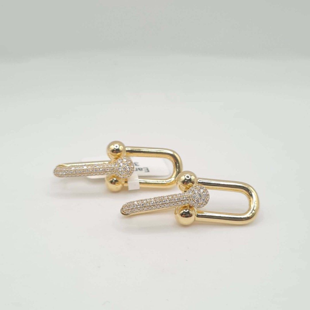 18k Tiffany diamond earrings (Category: Earrings) located in Makati City. Submitted by belalyn (Listing ID 1468320769, Image 1). Description: 8.6grams 18k gold 1.0ct dia .