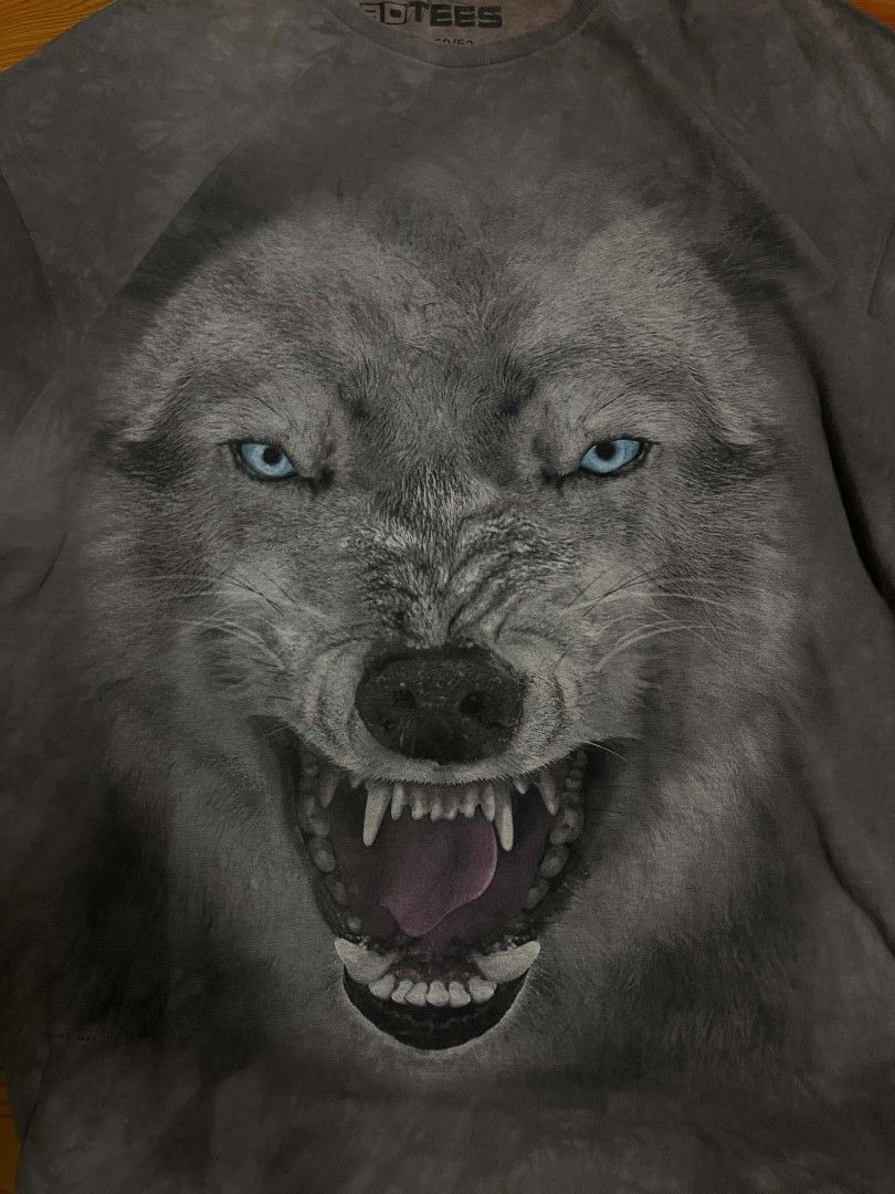 3DTEES 2XL Wolf Graphic T-Shirt (Category: Tshirts & Polo Shirts ) located in Ozamiz City. Submitted by tripft.vonde (Listing ID 1468311395, Image 2). Description: - Brand: 3DTEES - Design: Fierce wolf graphic print (Mike Sanford copyrighted artwork, 2014) - Color/Wash: Grey with tie-dye wash effect - Size: 2XL (Standard fit) - Material: 100% heavyweight cotton made in Honduras - Features: Crew neck, short sleeves - Care: Machine washable - Condi