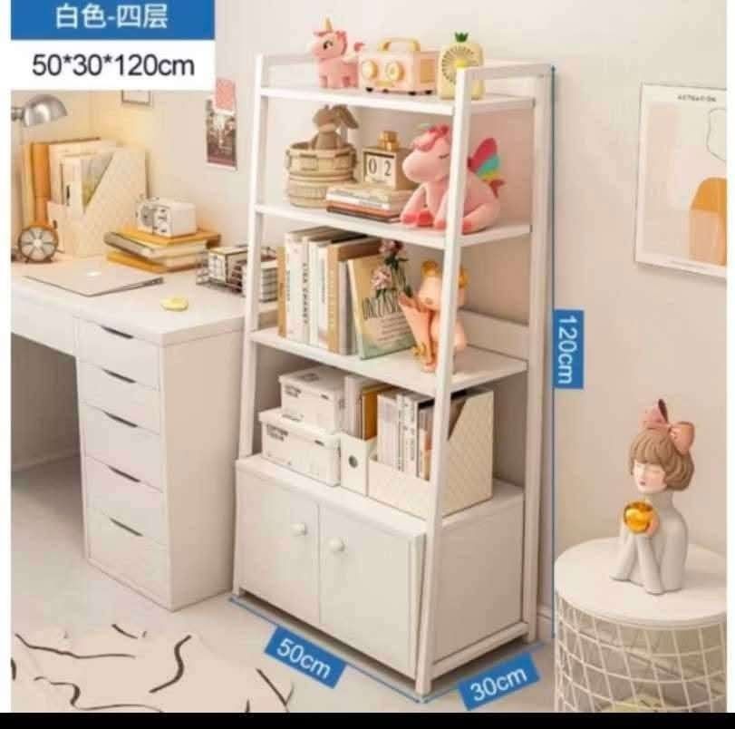 4-Tier White Storage Shelf with Cabinet (Category: Shelves, Cabinets & Racks) located in Manila. Submitted by ajimdolor012051 (Listing ID 1468395140, Image 2). Description: - Type: Bookshelf with bottom cabinet - Dimensions: 50cm (L) x 30cm (W) x 120cm (H) - Storage: 4 open tiers and a 2-door enclosed cabinet - Material: Sturdy white metal frame - Design: Clean, modern look - Perfect for: Organizing books, bags, and decor in compact spaces like s