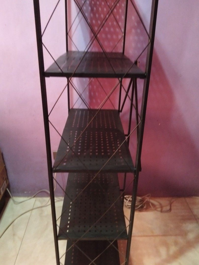 5-Tier Foldable Heavy Duty Storage Rack Black (Category: Shelves, Cabinets & Racks) located in Marikina City. Submitted by rareocean_9df934 (Listing ID 1468395237, Image 2). Description: - Color & Material: Black heavy-duty metal construction - Storage: 5 spacious, perforated shelves - Setup: 100% foldable with zero installation needed - Stability: Sturdy frame featuring X-cross bars on sides and back - Dimensions: 162cm (Height) x 71cm (Length) 