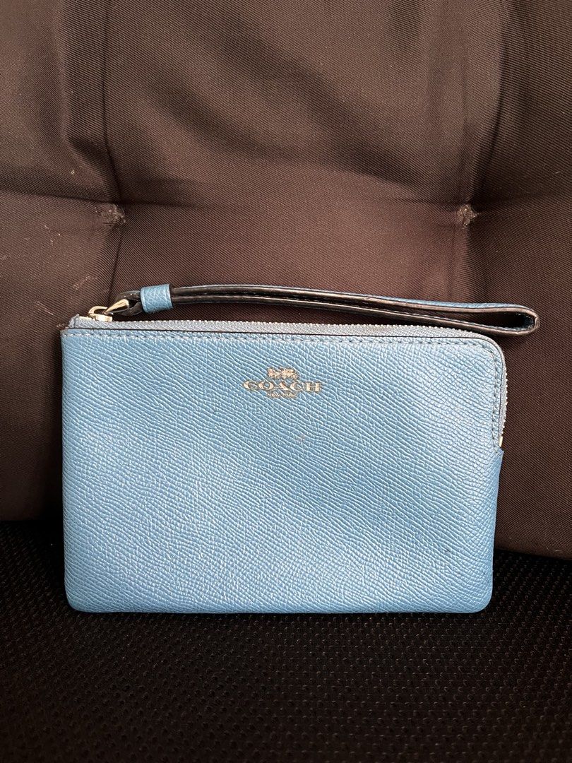 🇺🇸 Authentic Coach Blue Leather Wristlet (Category: Luxury Bags & Wallets) located in Manila. Submitted by prelovedpick.com (Listing ID 1468313853, Image 1). Description: Decluttering ‼️ With freebies - Brand: Coach - Material: Crossgrain leather in bright blue - Hardware: Silver-tone with secure zip closure - Features: Attached matching wrist strap, interior fabric lining with a slip pocket - Authenticity: Interior creed tag with serial number