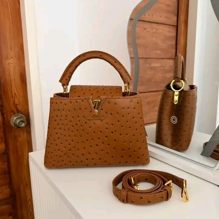 🖤 Louis Vuitton Ostrich Capucines BB Cognac (Category: Luxury Accessories) located in Caloocan City. Submitted by mohsin2 (Listing ID 1468309745, Image 3). Description: Louis Vuitton Ostrich Capucines BB Cognac 13,980p plus sf Genuine Ostrich leather Like new/Brandnew By Nicolas Ghesquière Brown Ostrich Brass Hardware Rolled Handle & Single Adjustable Shoulder Strap Leather Lining & Single Interior Pocket Fold-In Flap Closure at Top Protective F