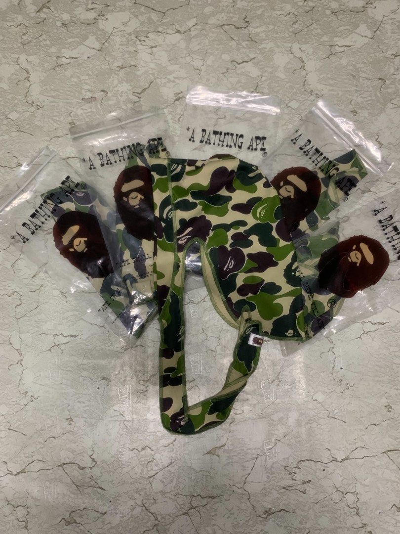 A Bathing Ape Bape Camo Durag (Category: Jeans) located in Manila. Submitted by grandfire-d26d (Listing ID 1468425577, Image 3). Description: - Brand: A Bathing Ape (BAPE) - Item: Green Camo Print Durag - Details: Iconic Ape head logo graphic on side ties - Fit: Long straps for easy styling and adjustable fit - Condition: Brand new, comes sealed in original branded zip-lock bag - Availability: Multiple pieces available.
