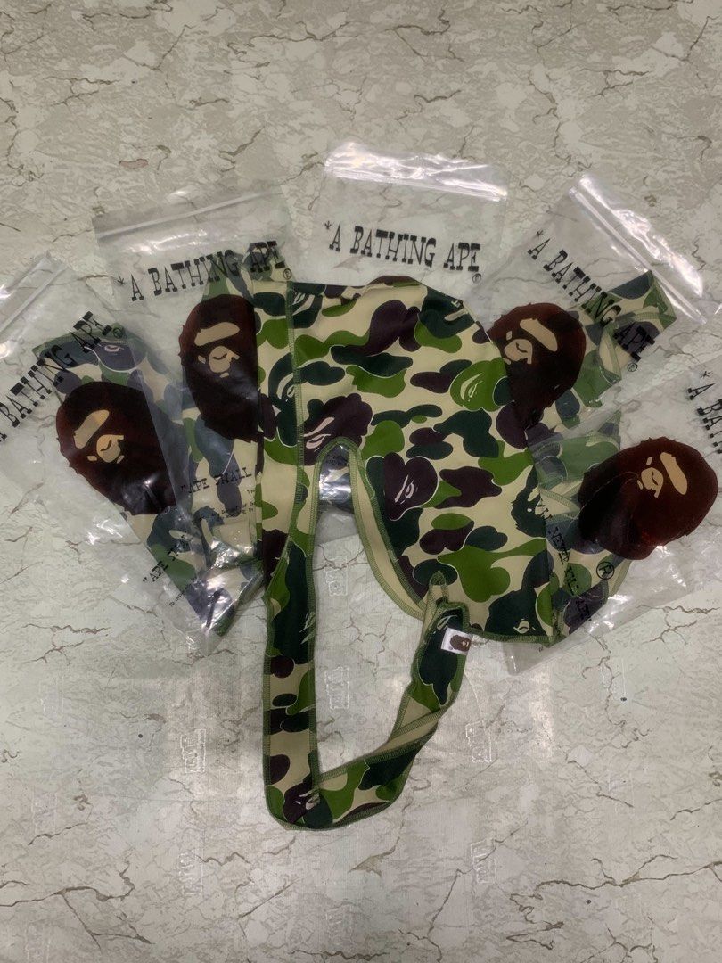 A Bathing Ape Bape Camo Durag (Category: Jeans) located in Manila. Submitted by grandfire-d26d (Listing ID 1468425577, Image 1). Description: - Brand: A Bathing Ape (BAPE) - Item: Green Camo Print Durag - Details: Iconic Ape head logo graphic on side ties - Fit: Long straps for easy styling and adjustable fit - Condition: Brand new, comes sealed in original branded zip-lock bag - Availability: Multiple pieces available.