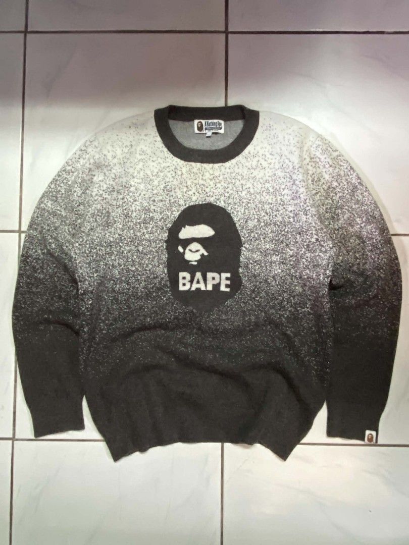 A Bathing Ape Bape Gradient Camo Ape Head Sweater (Category: Coats, Jackets and Outerwear) located in Angeles City. Submitted by pkthreadz (Listing ID 1468305000, Image 1). Description: - Brand: A Bathing Ape (Bape) - Item: Heavyweight knit sweater - Color/Design: Black and white gradient speckle wash with iconic ape head logo and text branding - Details: Dark charcoal ribbed collar, cuffs, and hem, includes classic neck, size, and sleeve tags - 