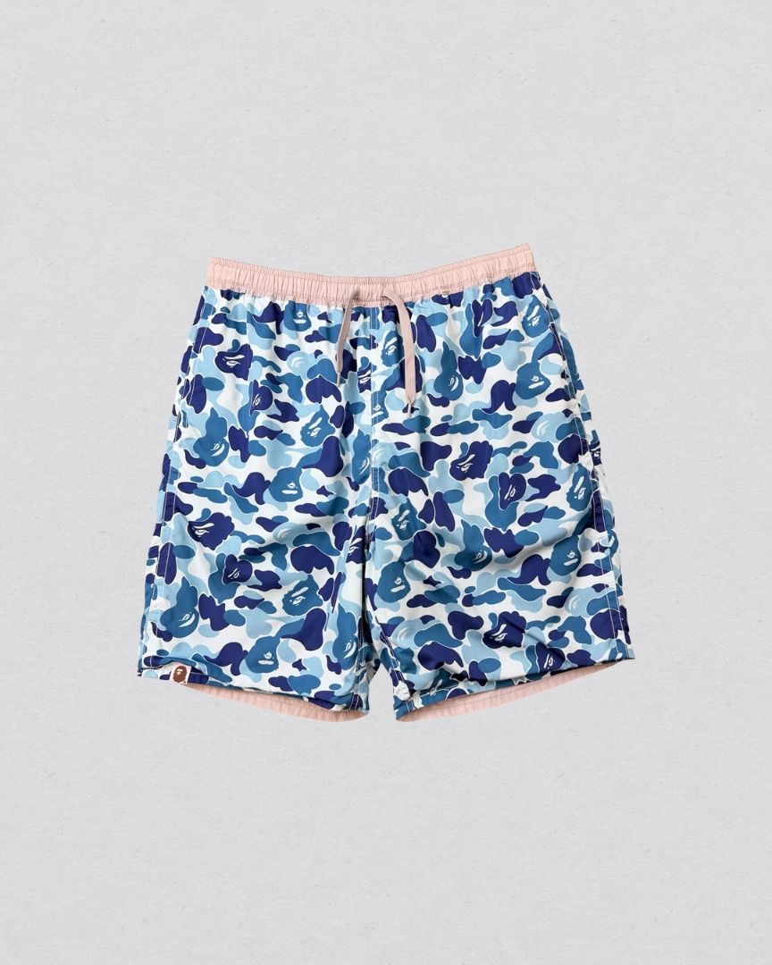 A Bathing Ape Blue Camou Reversible Nylon shorts (Category: Shorts) located in Cabanatuan. Submitted by argarments.ph (Listing ID 1468377726, Image 1). Description: Tagged: Medium on tag Waist 28-32" | Length 18.5" | Leg opening 10.5" | Thigh 11.5" | Rise 14" Condition: Great condition Issue(s): Small dirt stain and small scratch. see photos.
