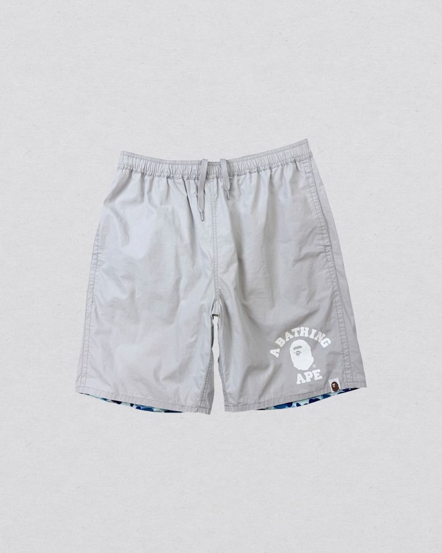 A Bathing Ape Blue Camou Reversible Nylon shorts (Category: Shorts) located in Cabanatuan. Submitted by argarments.ph (Listing ID 1468377726, Image 2). Description: Tagged: Medium on tag Waist 28-32" | Length 18.5" | Leg opening 10.5" | Thigh 11.5" | Rise 14" Condition: Great condition Issue(s): Small dirt stain and small scratch. see photos.