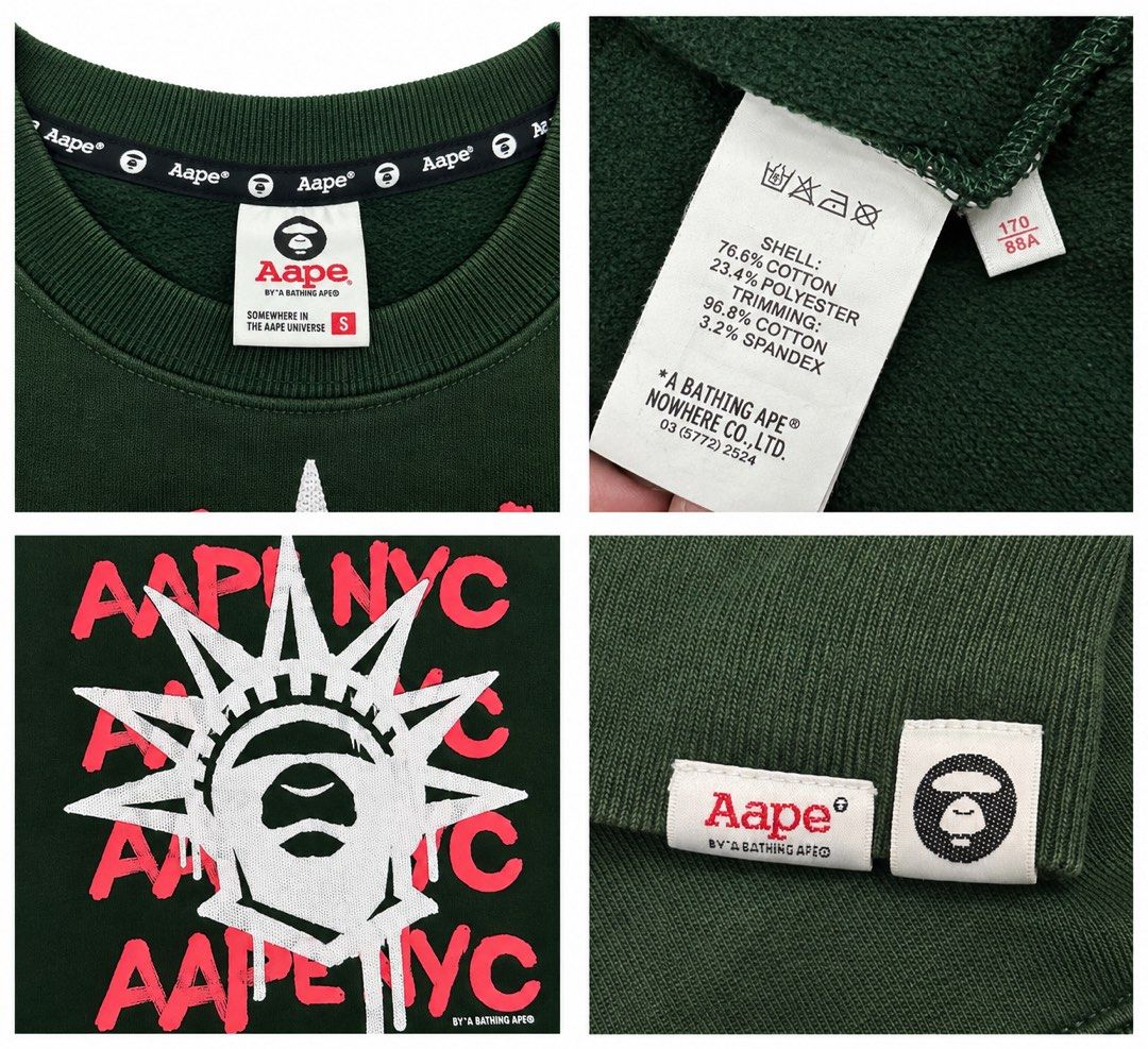 Aape By A Bathing Ape NYC Green Sweatshirt (Category: Coats, Jackets and Outerwear) located in Manila. Submitted by comeonthrift (Listing ID 1468465131, Image 2). Description: - Brand: Aape by A Bathing Ape - Color: Green - Size: Small - Design: Large white Statue of Liberty ape graphic with pink Aape NYC text on front - Details: Signature camo patches on both sleeves with small white graphics - Material: Comfortable cotton and polyester blend - 
