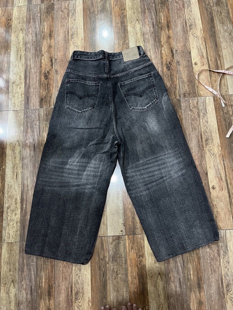 Acid black baggy pants (Category: Jeans) located in Adams. Submitted by y2kchocothrift (Listing ID 1468468344, Image 2). Description: Waist 30 Length 39 Thigh 14 Leghole11 Hard denim.