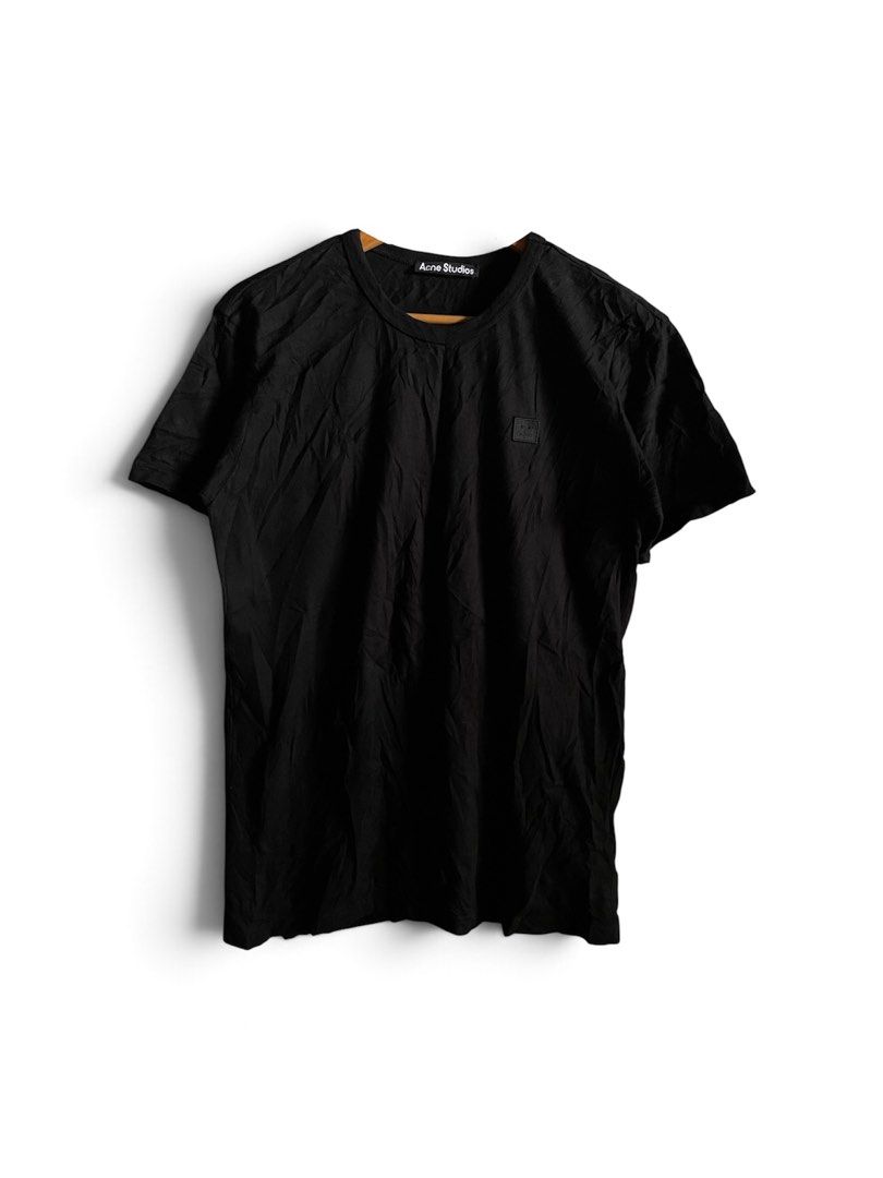 Acne Studios Black Face Patch T-shirt (Category: Shirts) located in M'Lang. Submitted by thrift_finds2 (Listing ID 1468305420, Image 1). Description: - Brand: Acne Studios - Color: Black - Size: Small - Material: Premium cotton - Fit: Classic fit with short sleeves - Details: Subtle tonal face patch logo on the chest and standard branded neck label - Condition: Great pre-loved condition - Style: Essential everyday basic piece.
