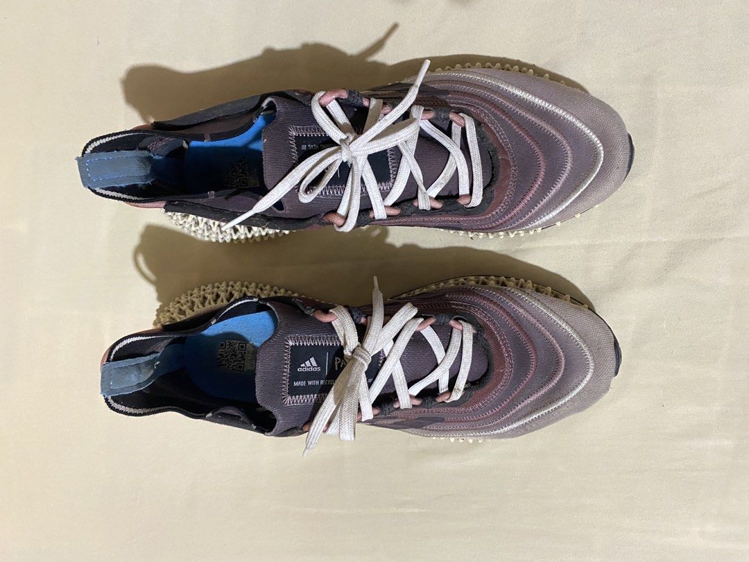 Adidas 4D Runner Sneakers (Category: Sneakers) located in Polangui. Submitted by thrift2house (Listing ID 1468365712, Image 2). Description: - Brand: Adidas - Model: Adidas 4D - Colorway: Mauve, white, and blue inner lining - Upper: Made with Parley recycled materials - Sole: Futuristic lattice midsole with black rubber outsole - Condition: Pre-owned with dirt marks on midsoles and regular wear on outsoles - Inclusions: Comes with white laces.