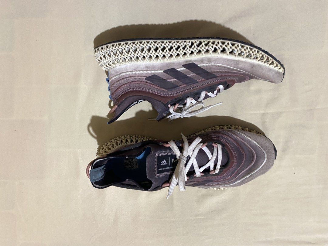 Adidas 4D Runner Sneakers (Category: Sneakers) located in Polangui. Submitted by thrift2house (Listing ID 1468365712, Image 1). Description: - Brand: Adidas - Model: Adidas 4D - Colorway: Mauve, white, and blue inner lining - Upper: Made with Parley recycled materials - Sole: Futuristic lattice midsole with black rubber outsole - Condition: Pre-owned with dirt marks on midsoles and regular wear on outsoles - Inclusions: Comes with white laces.