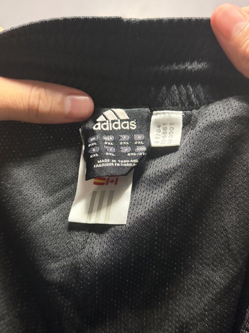 Adidas Black, Grey, and White Athletic Shorts (Category: Shorts) located in Manila. Submitted by swiftgem.eeb06e (Listing ID 1468390983, Image 3). Description: - Brand: Adidas - Color: Black with white checkered side panels and piping details - Material: Lightweight sport fabric for maximum comfort - Waistband: Elastic with adjustable drawstring - Branding: Small printed Adidas wordmark logo on the lower left hem - Condition: Excellent / Ready to