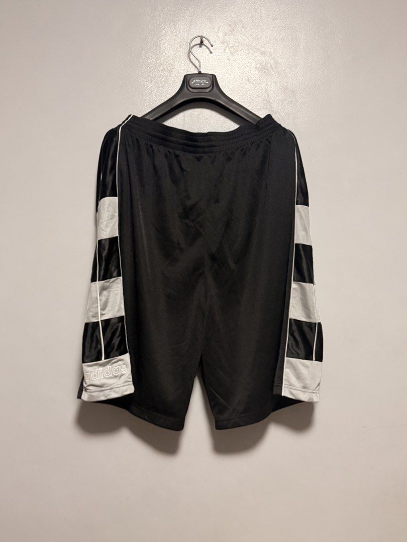Adidas Black, Grey, and White Athletic Shorts (Category: Shorts) located in Manila. Submitted by swiftgem.eeb06e (Listing ID 1468390983, Image 2). Description: - Brand: Adidas - Color: Black with white checkered side panels and piping details - Material: Lightweight sport fabric for maximum comfort - Waistband: Elastic with adjustable drawstring - Branding: Small printed Adidas wordmark logo on the lower left hem - Condition: Excellent / Ready to