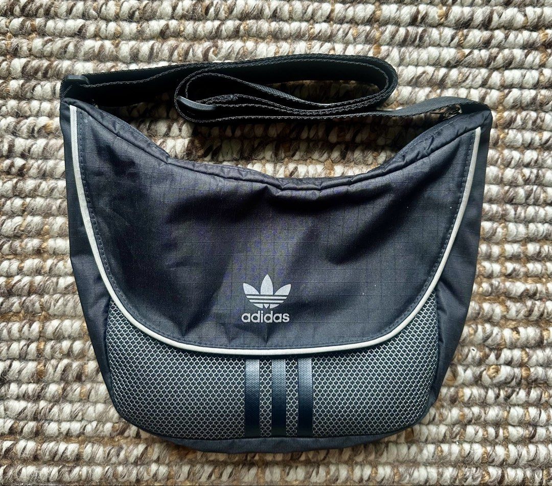 Adidas Black Shoulder Bag (Category: Sling Bags) located in Makati City. Submitted by jerbinator11 (Listing ID 1468289154, Image 1). Description: Dimensions: 5 cm x 32 cm x 24.5 cm Volume: 5.75 L 100% authentic with receipt. Perfect for daily use and for travel. Pm for more details. Makati located .