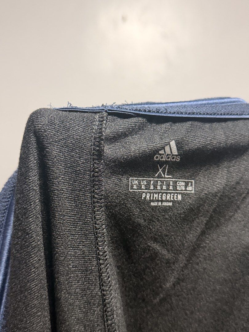 Adidas Black Track Pants with Grey Stripes (Category: Activewear) located in Manila. Submitted by swiftgem.eeb06e (Listing ID 1468390234, Image 3). Description: - Authentic Black Adidas track pants - Classic three stripes on the sides with iconic Adidas logo near the pocket - Elastic waistband with adjustable drawstring for a secure fit - Lightweight material, perfect for workouts or casual lounging - Straight leg fit with clean hems - Condition: