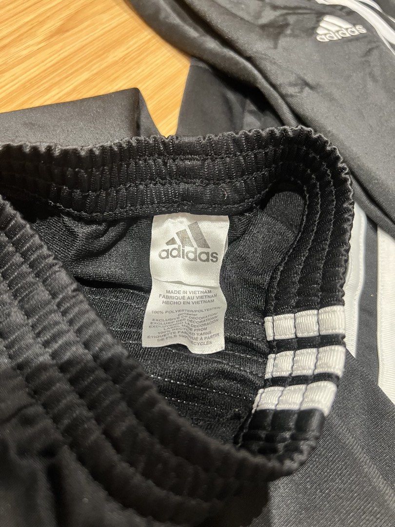 Adidas Black White Stripe Track Pants Size 7 (Category: Babies & Kids Fashion) located in Taguig. Submitted by fifileen (Listing ID 1468380967, Image 3). Description: - Brand: Adidas - Color: Classic black with white side stripes - Material: 100% lightweight polyester - Features: Elastic waistband and embroidered white Adidas logo on left leg - Size: Size 7 -authentic bought from US ₱600 each.
