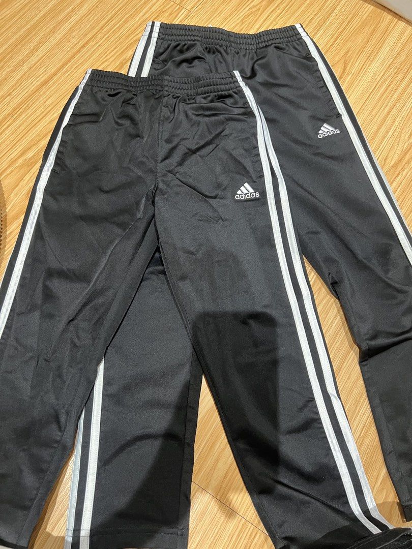Adidas Black White Stripe Track Pants Size 7 (Category: Babies & Kids Fashion) located in Taguig. Submitted by fifileen (Listing ID 1468380967, Image 1). Description: - Brand: Adidas - Color: Classic black with white side stripes - Material: 100% lightweight polyester - Features: Elastic waistband and embroidered white Adidas logo on left leg - Size: Size 7 -authentic bought from US ₱600 each.