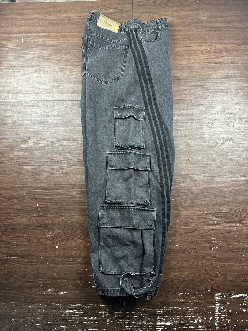 Adidas Denim Cargo Pants Washed Black Size 28 (Category: Jeans) located in Manila. Submitted by kupal24 (Listing ID 1468376728, Image 2). Description: - Brand: Adidas - Item: Washed Black Denim Cargo Pants - Size: 28 US - Style Code: IV9345 - Fit: Relaxed fit with durable denim material - Details: Signature three stripes, multiple utility cargo pockets, adjustable hem straps - Branding: Embroidered trefoil logo on hip and Adidas paper patch on ba