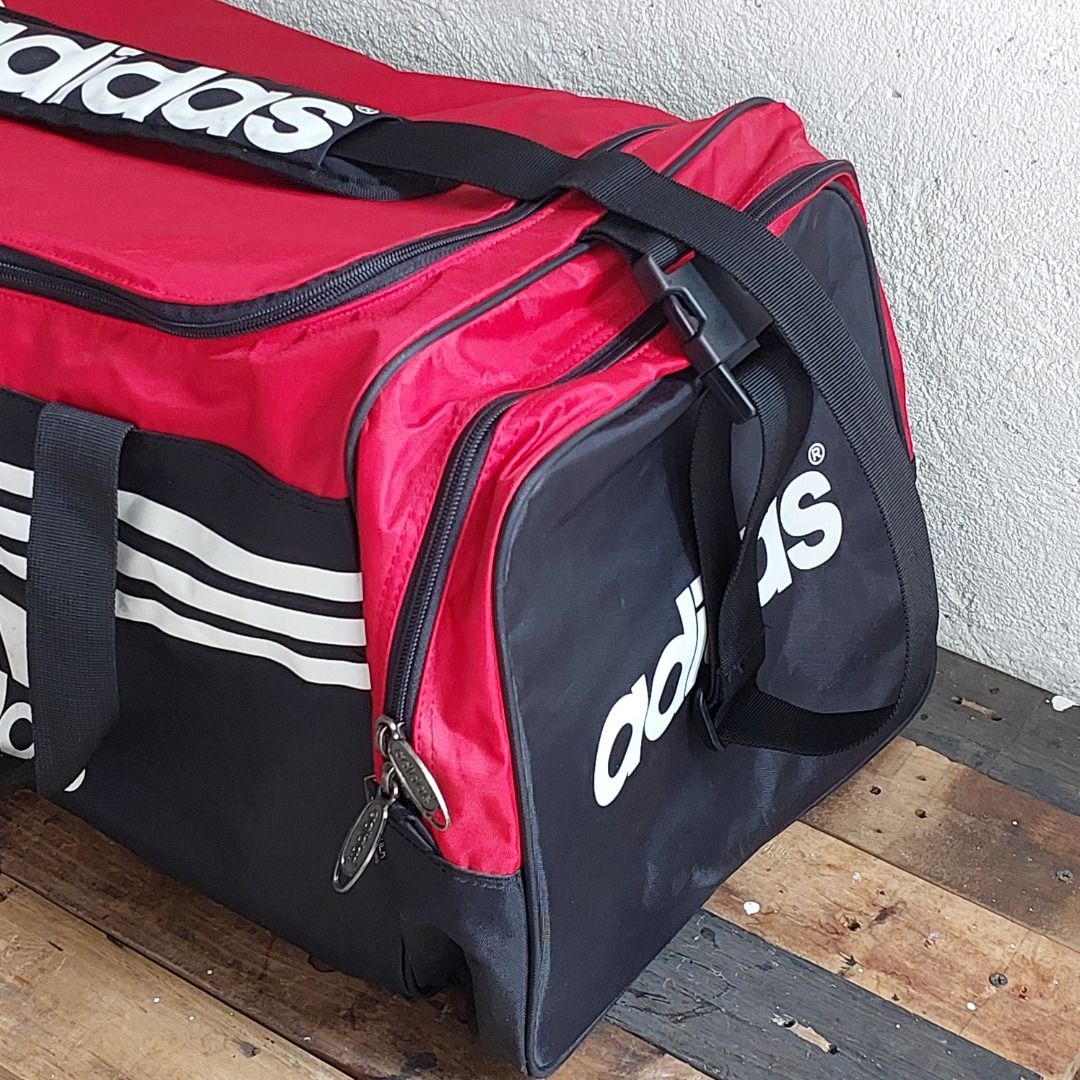 Adidas Duffle Bag Red Black (Category: Sling Bags) located in Caloocan City. Submitted by 2ndhand.manila (Listing ID 1468292086, Image 3). Description: Sira ang zipper sa shoe compartment. Hindi nagsasara. Swipe left for more photos and measurements. ▪️NO COD/COP ▪️Ship thru J&T ▪️Lalamove/Grab Express ▪️G-Cash or Bank Transfer ▪️Location: North Caloocan.