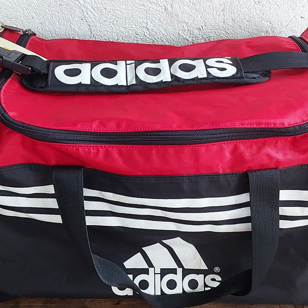 Adidas Duffle Bag Red Black (Category: Sling Bags) located in Caloocan City. Submitted by 2ndhand.manila (Listing ID 1468292086, Image 2). Description: Sira ang zipper sa shoe compartment. Hindi nagsasara. Swipe left for more photos and measurements. ▪️NO COD/COP ▪️Ship thru J&T ▪️Lalamove/Grab Express ▪️G-Cash or Bank Transfer ▪️Location: North Caloocan.
