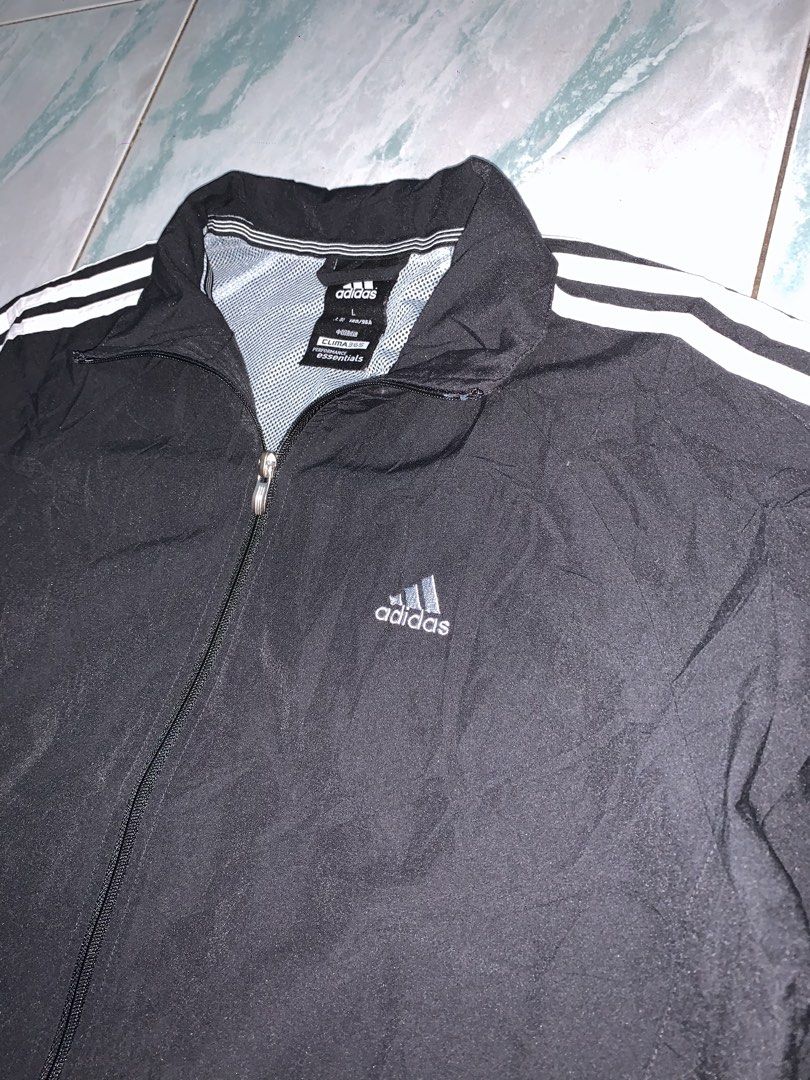 Adidas full zip windbreaker (Category: Coats, Jackets and Outerwear) located in Pasig City. Submitted by thriftnflip1600 (Listing ID 1468462713, Image 2). Description: L on tag Width: 21” Length: 26” Color rate: 9+/10 Condition: 9+/10 No issues.