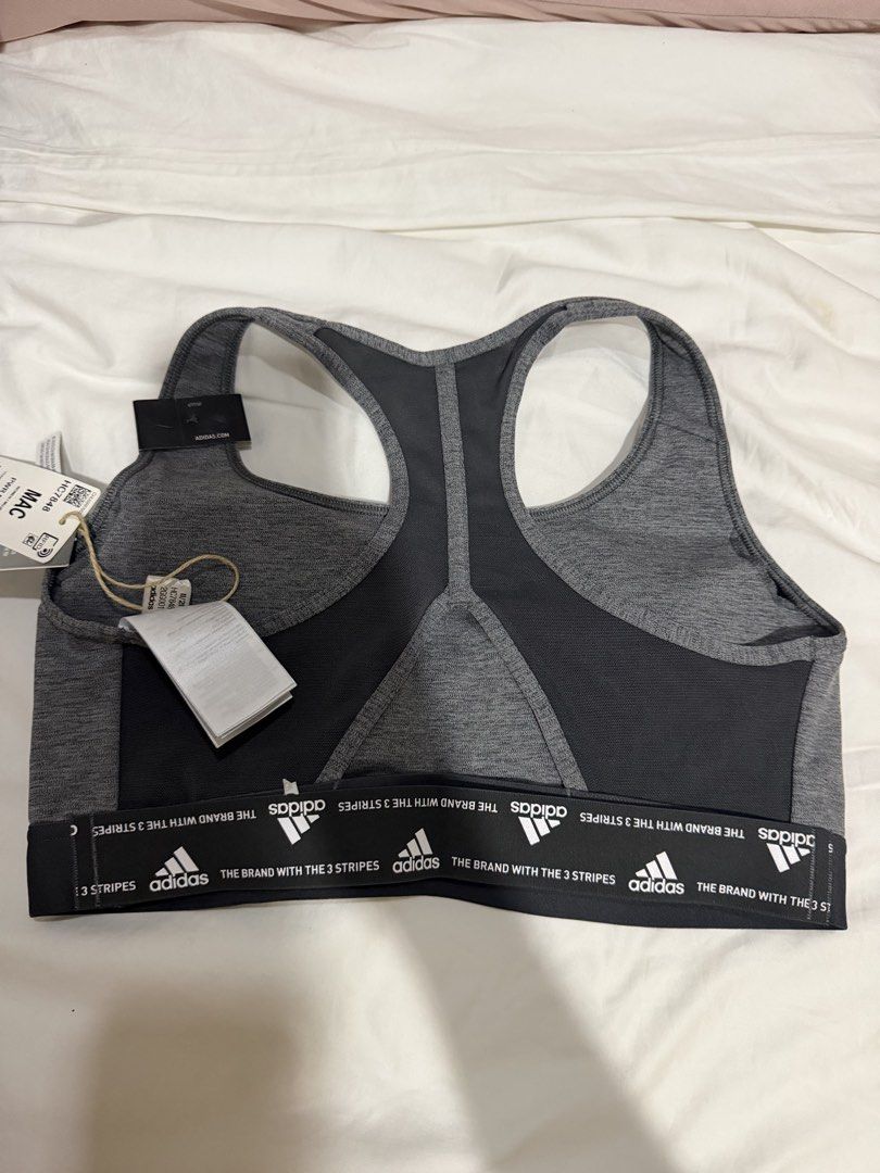 Adidas Medium Support Training Bra Dark Grey Heather Size 40AC (Category: Activewear) located in Manila. Submitted by bellafleur (Listing ID 1468397451, Image 2). Description: - Brand: Adidas - Color: Dark grey heather - Size: 40AC - Condition: Brand new with original tags attached, never worn - Support: Medium support design - Features: Breathable mesh racerback panels for ventilation - Details: Elastic underband with repeated logo text and icon