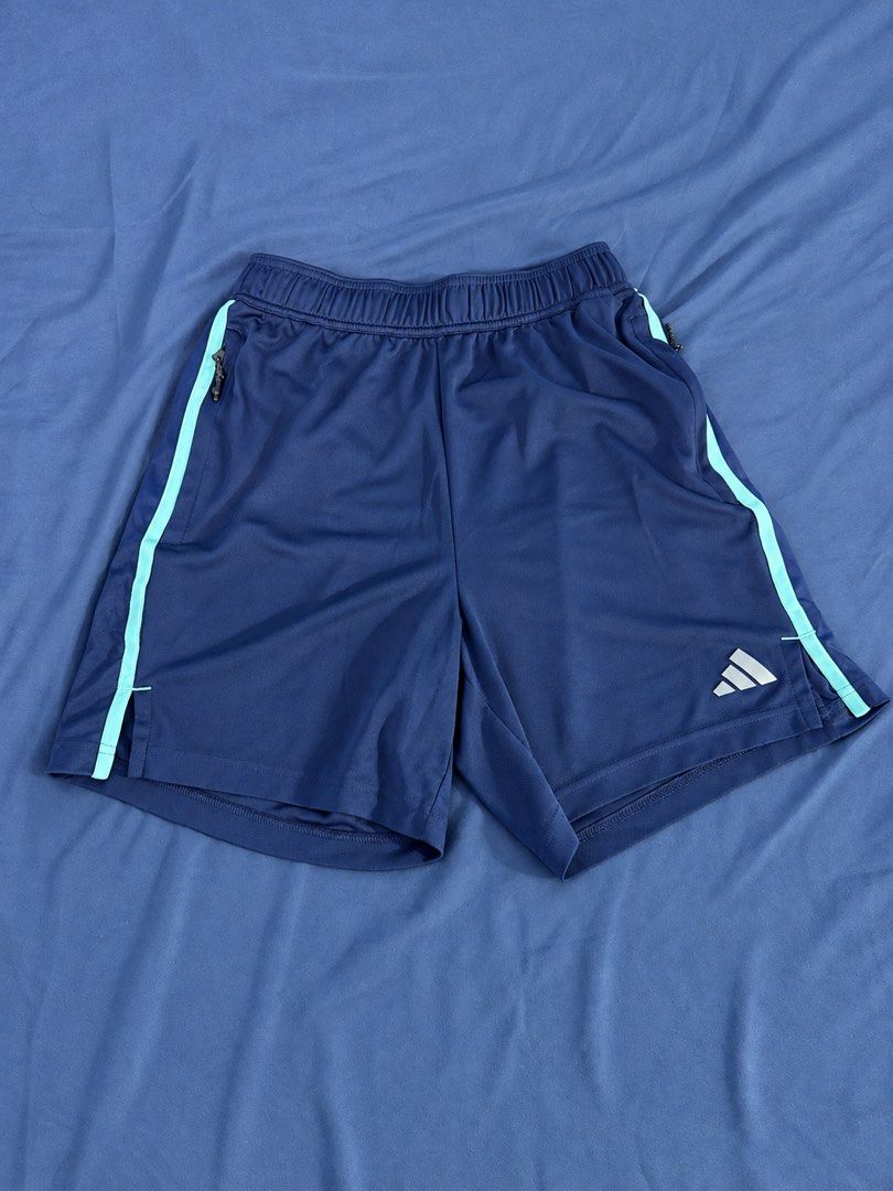 Adidas Navy Blue Athletic Shorts Size M (Category: Shorts) located in Manila. Submitted by throughhim (Listing ID 1468460229, Image 1). Description: - Brand: Adidas - Color: Navy blue with light blue side stripes - Size: US Medium (Regular fit) - Material/Tech: Aeroready technology fabric to keep you dry - Features: Secure zipper pockets, elastic waistband with drawstring - Origin: Made in Thailand - Condition: Excellent / Ready to wear.