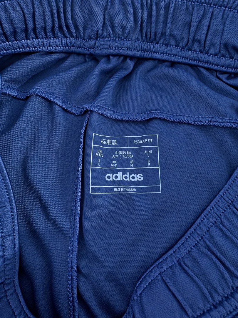 Adidas Navy Blue Athletic Shorts Size M (Category: Shorts) located in Manila. Submitted by throughhim (Listing ID 1468460229, Image 3). Description: - Brand: Adidas - Color: Navy blue with light blue side stripes - Size: US Medium (Regular fit) - Material/Tech: Aeroready technology fabric to keep you dry - Features: Secure zipper pockets, elastic waistband with drawstring - Origin: Made in Thailand - Condition: Excellent / Ready to wear.
