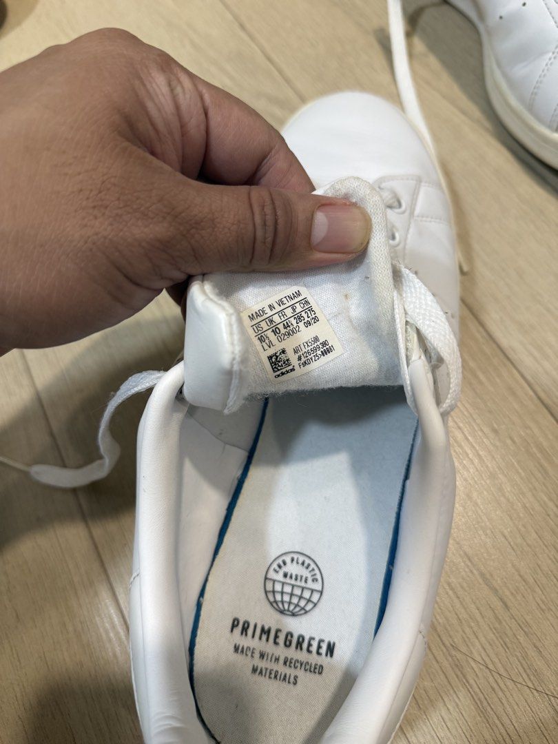 Adidas Stan Smith White Primegreen Sneakers (Category: Sneakers) located in Cavite. Submitted by bronurams2000 (Listing ID 1468455600, Image 3). Description: - Brand: Adidas Stan Smith - Color: Classic White - Size: US 10.5 / UK 10 / EU 44 2/3 - Material: Primegreen recycled materials - Condition: Clean leather upper, minor dirt on soles from normal walking - Details: Standard white laces, iconic Stan Smith tongue graphic.