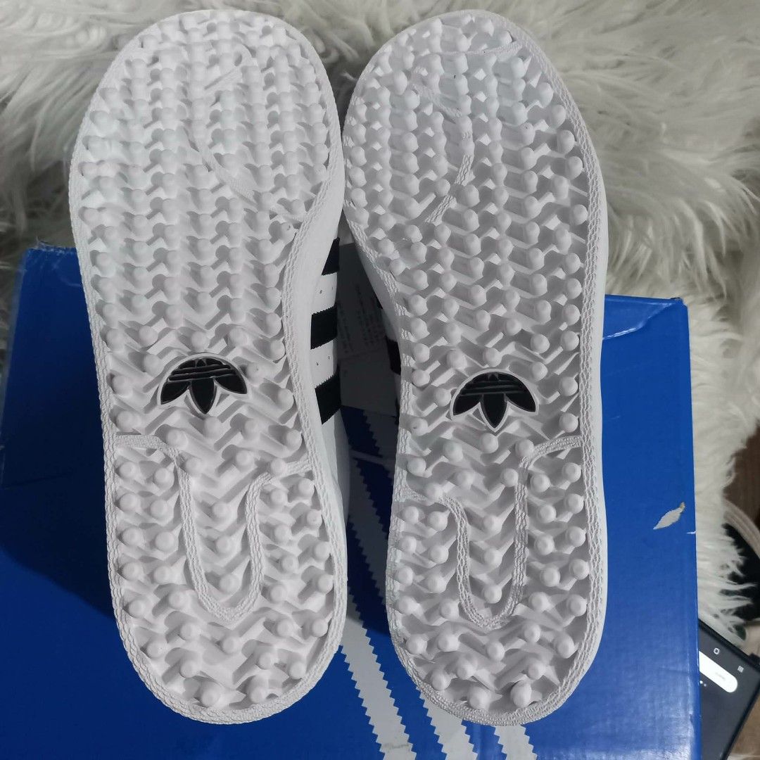 Adidas Superstar Golf Shoes Core Black White (Category: Sneakers) located in Cavite. Submitted by tobias_7795 (Listing ID 1468443063, Image 2). Description: - Brand: Adidas Superstar Golf Shoes - Color: White with Black Stripes - Condition: Brand new with tags attached on laces - Size: US 9 / UK 8.5 / EU 42 2/3 - Design: Classic shell toe with specialized spiked outsoles for maximum grip on the course - Inclusion: Comes with original blue and whi